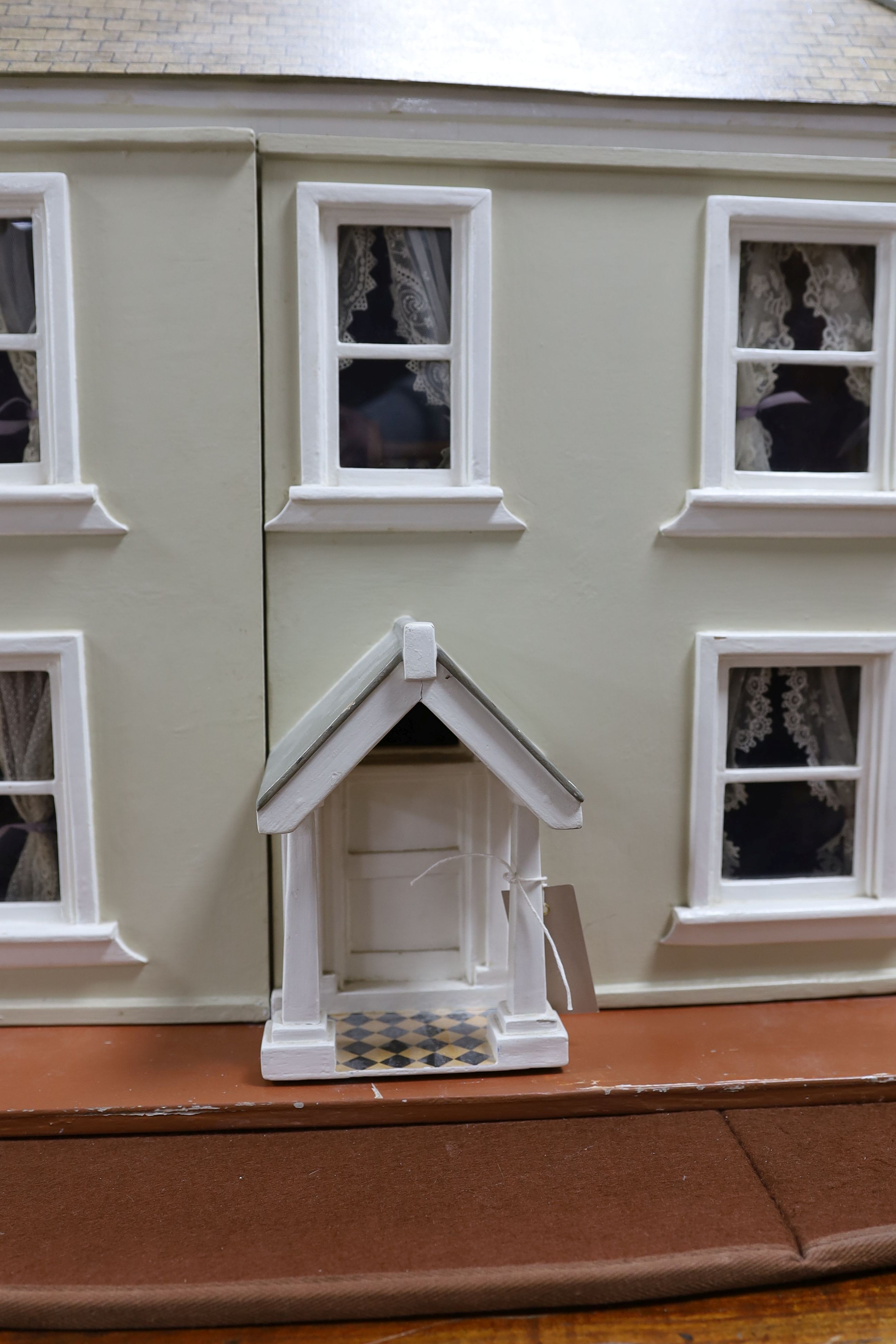 A dolls house, length 74cm, depth 39cm, height 66cm